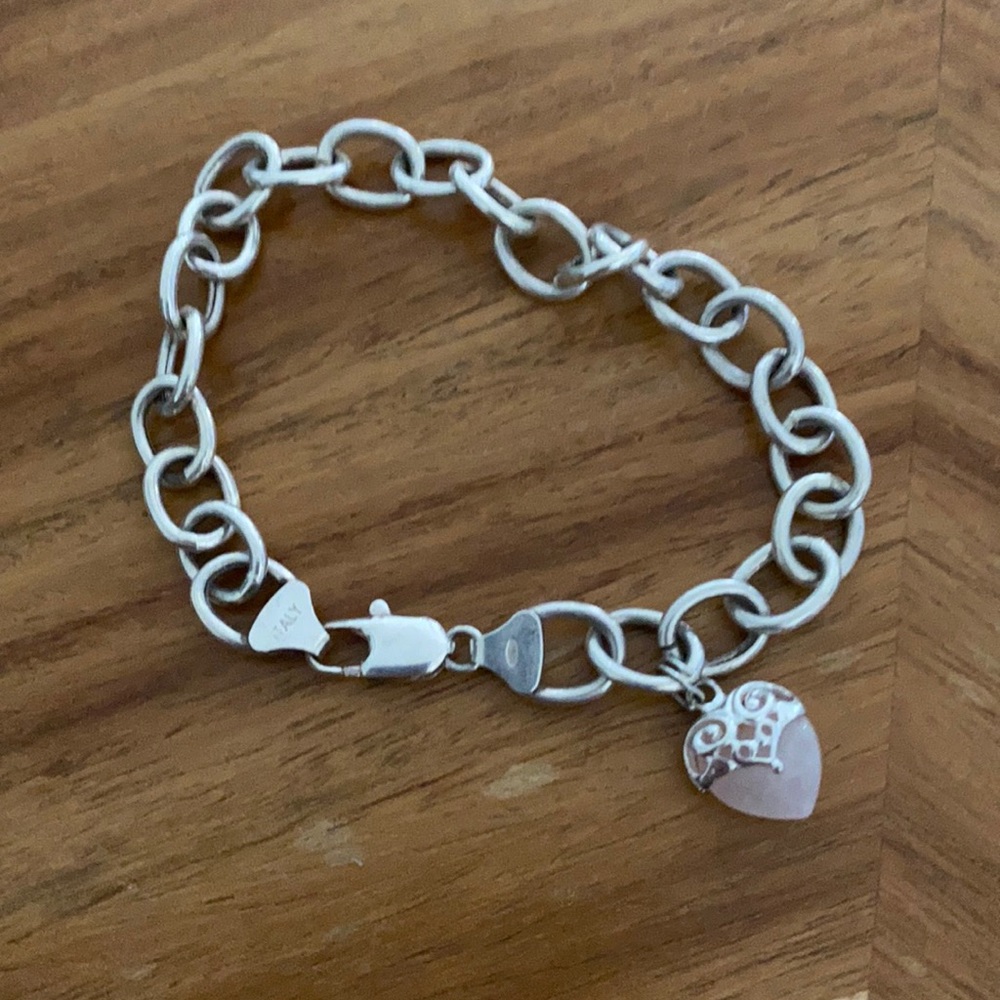 Chunky silver bracelet with quartz heart charm